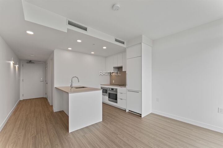 Property Photo: 13675 107A Avenue 3003 BC V3T 0X3