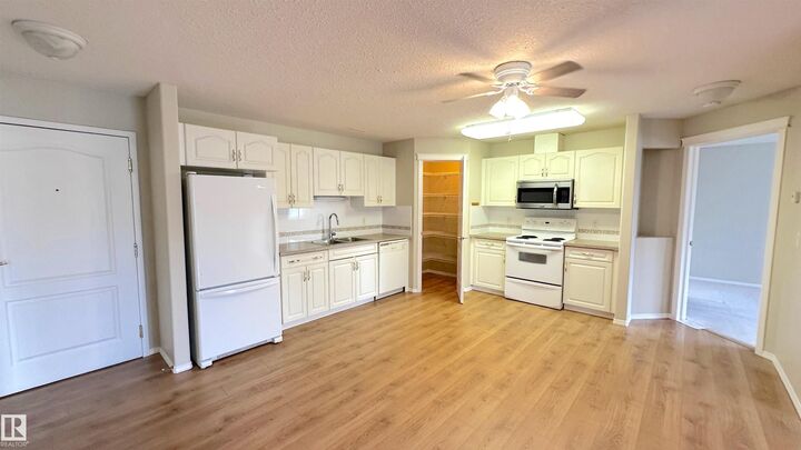 Property Photo: 237 Youville Drive NW 218 AB T6L 7G2