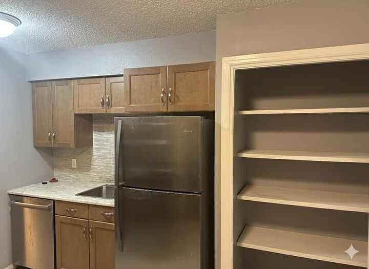 Property Photo: 7201 Poplar Drive 3105 AB T8V 6C5
