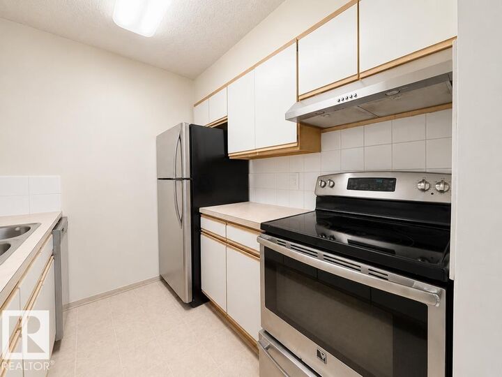 Property Photo:  5065 31 Avenue NW 218  AB T6L 6S5 