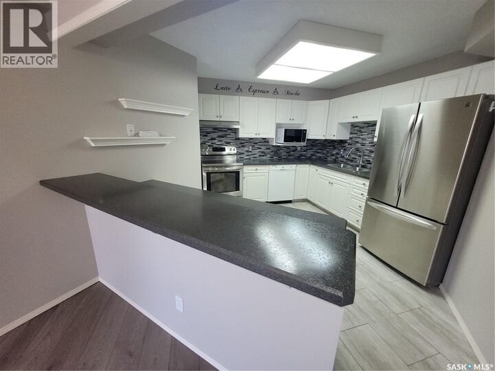 Property Photo:  409 301 Cree Crescent  SK S7K 7Y3 