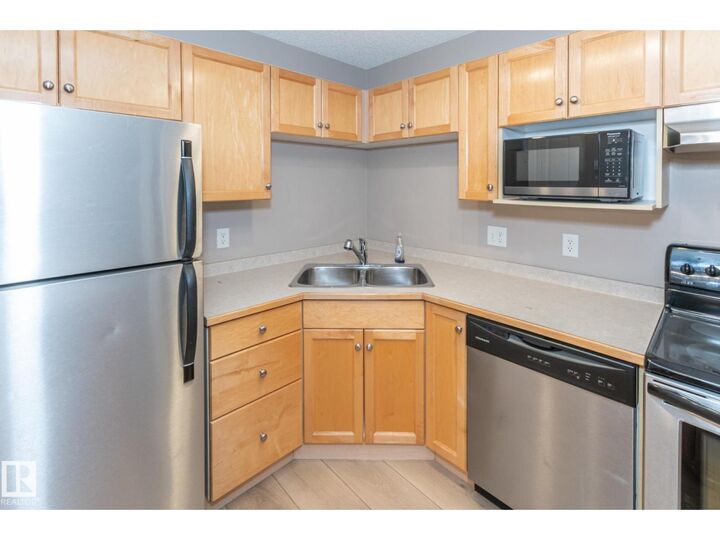 Property Photo:  #119 245 Edwards Dr SW  AB T6X 1J9 