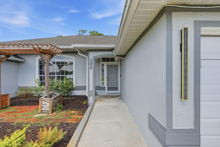 Property Photo: 102 NW Peach Street FL 34983