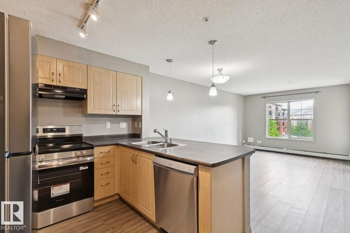 Property Photo: 11453 Ellerslie Road SW 312 AB T6W 1T3