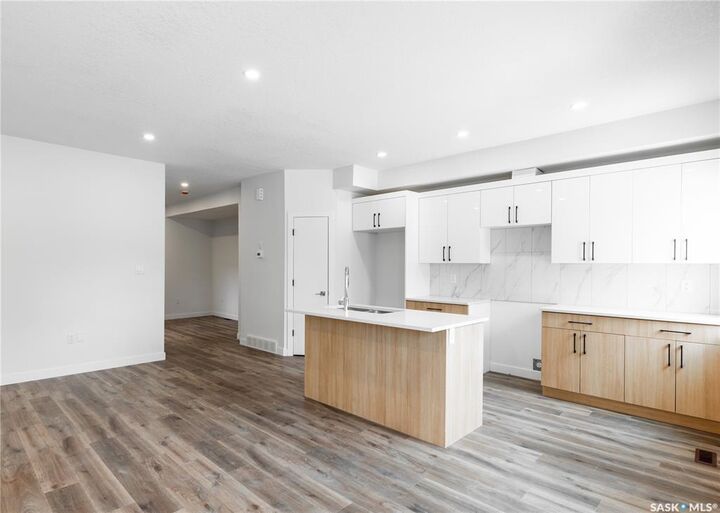 Property Photo: 4513 Green Brooks Way E B SK S4V 3K5