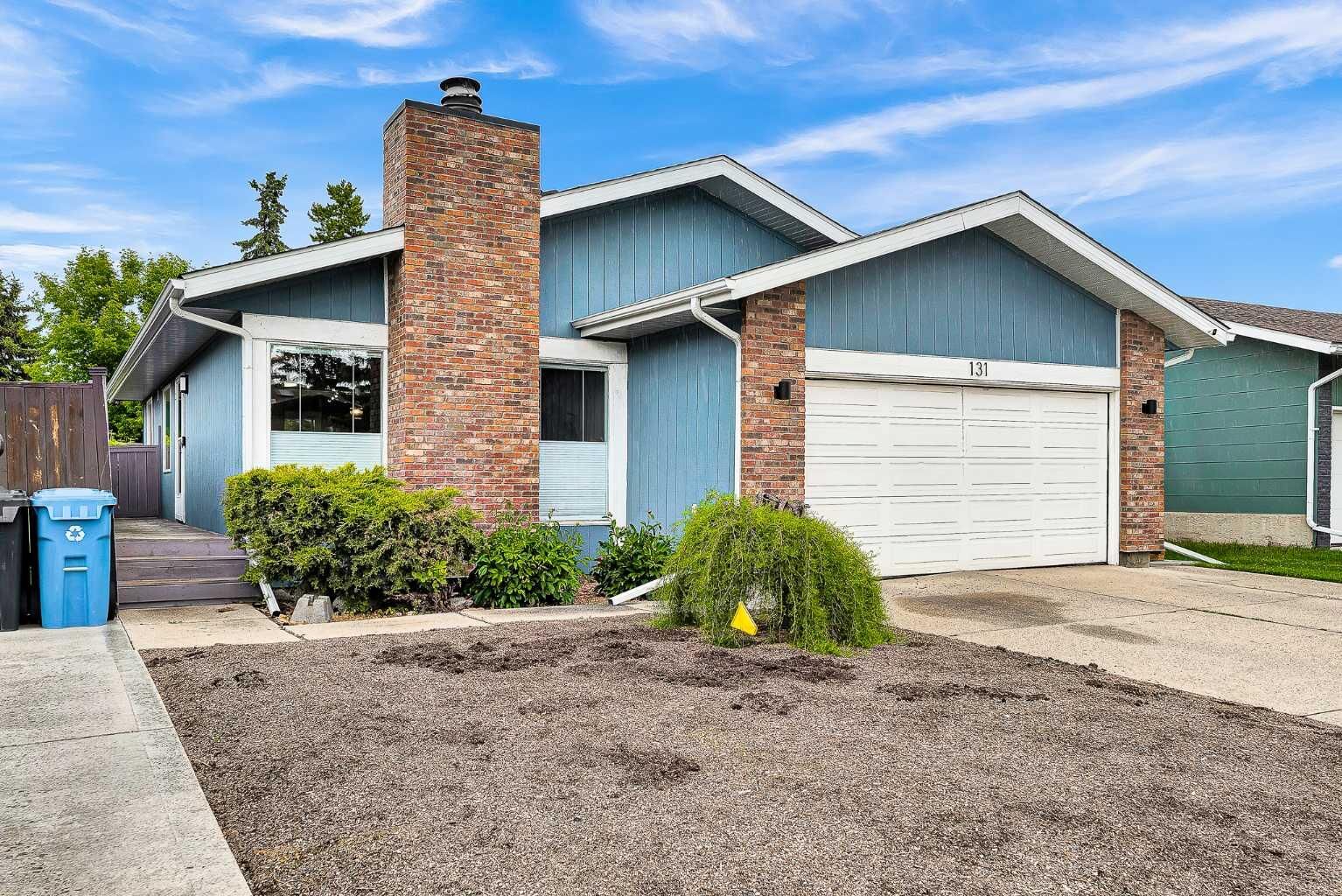 Property Photo:  131 Deer Run Close SE  AB T2J 5P7 