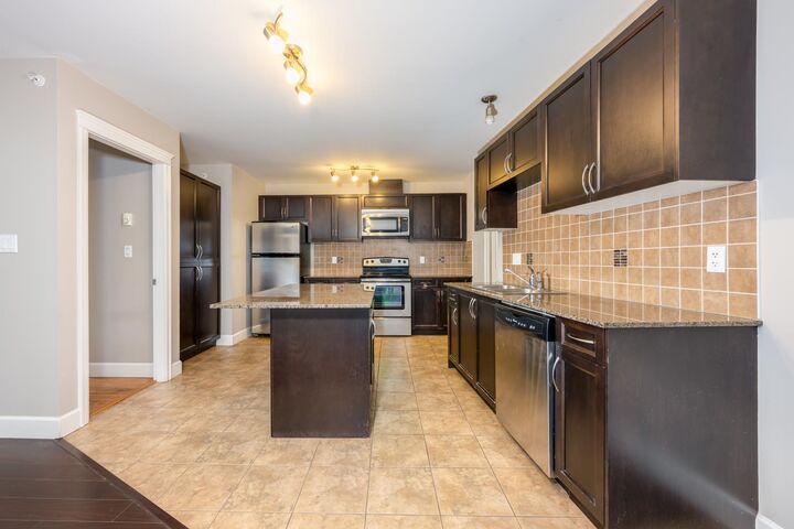 Property Photo: 12088 75A Avenue 311 BC V3W 1Y4