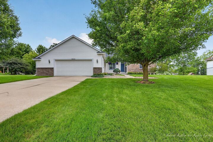 Property Photo:  2033 Orchard Ridge Drive NW  MI 49534 
