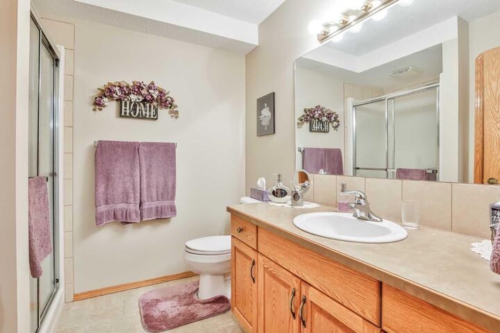 Property Photo:  4800A 48 Avenue 210  AB T1G 2G9 