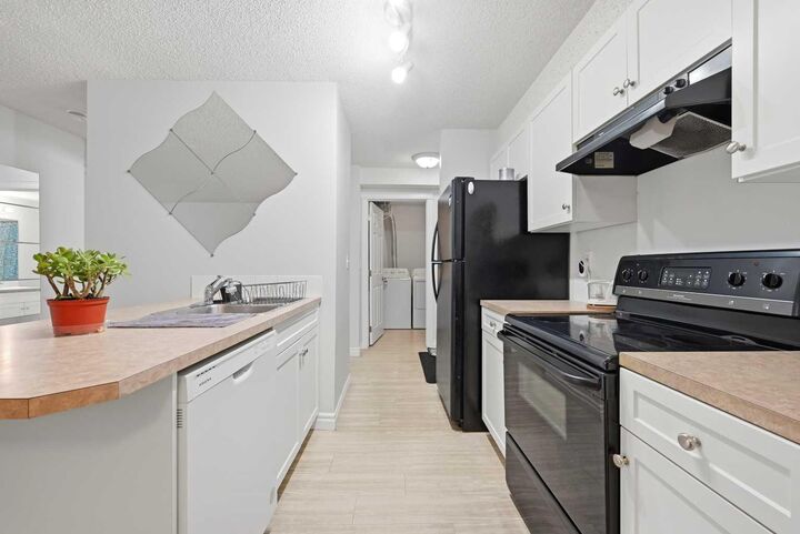 Property Photo: 5555 Falsbridge Drive NE 111 AB T3J 3E8
