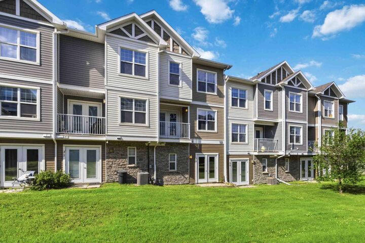 Property Photo:  180 Riverstone Ridge 30  AB T9K 0V6 