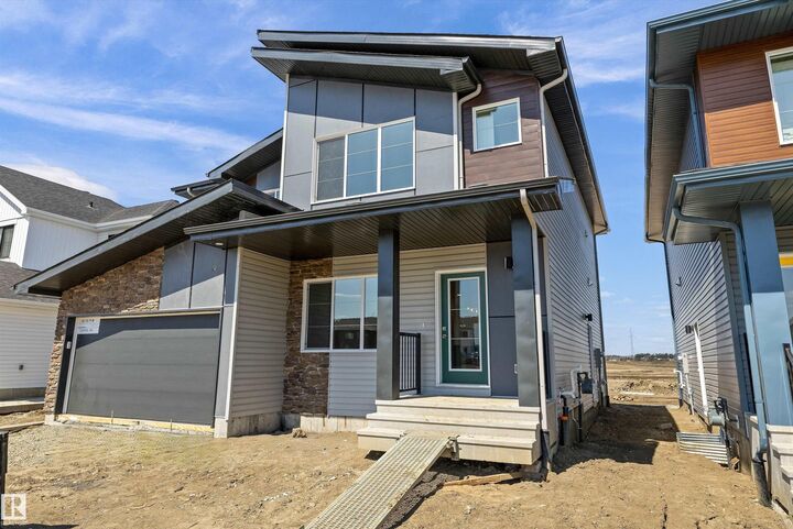 Property Photo:  618 176 Avenue NE  AB T5Y 4J9 