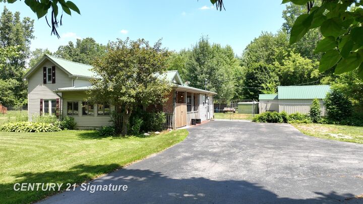Property Photo:  12164 N Elms Road  MI 48420 