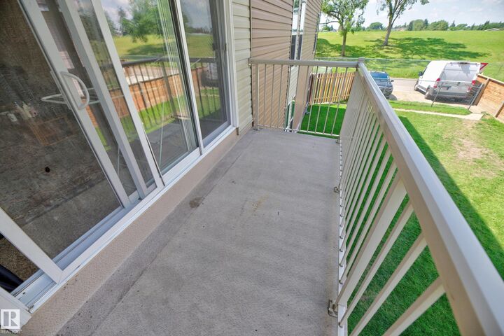 Property Photo: 7220 144 Avenue NW 209 AB T4C 3E4