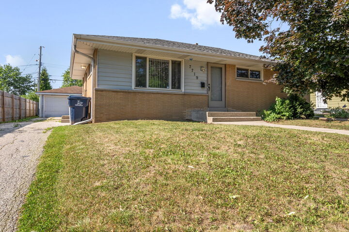 Property Photo:  7719 W Winfield Ave  WI 53218 