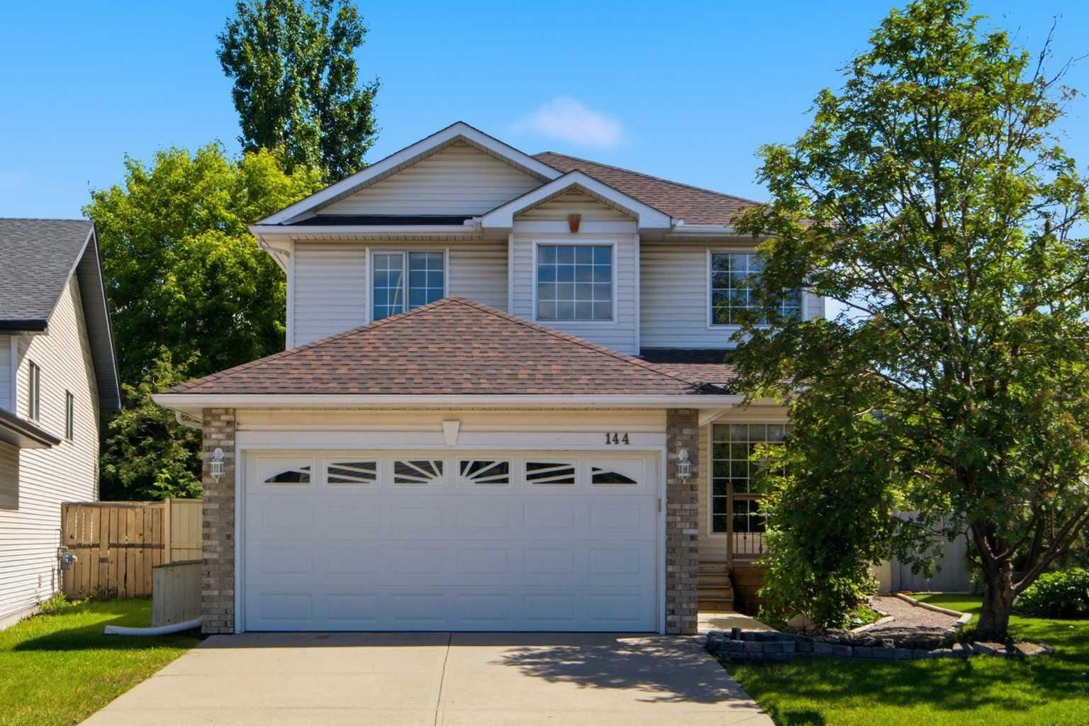 Property Photo:  144 Douglas Ridge Close SE  AB T2Z 2P6 