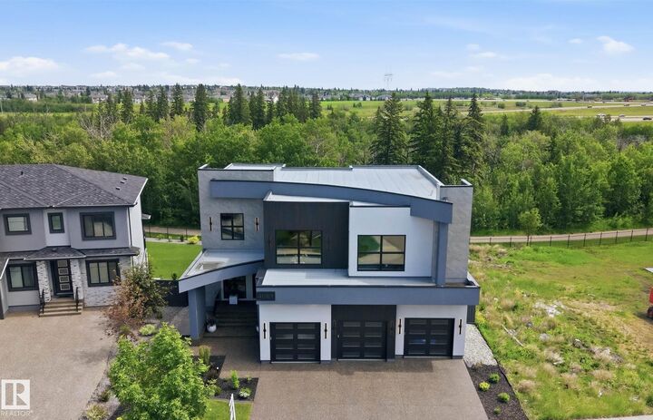 Property Photo: 4081 Whispering River Drive SW AB T6W 2E2