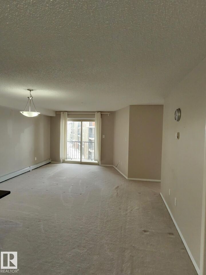 Property Photo: 1060 McConachie Boulevard NW 303 AB T5J 0W9