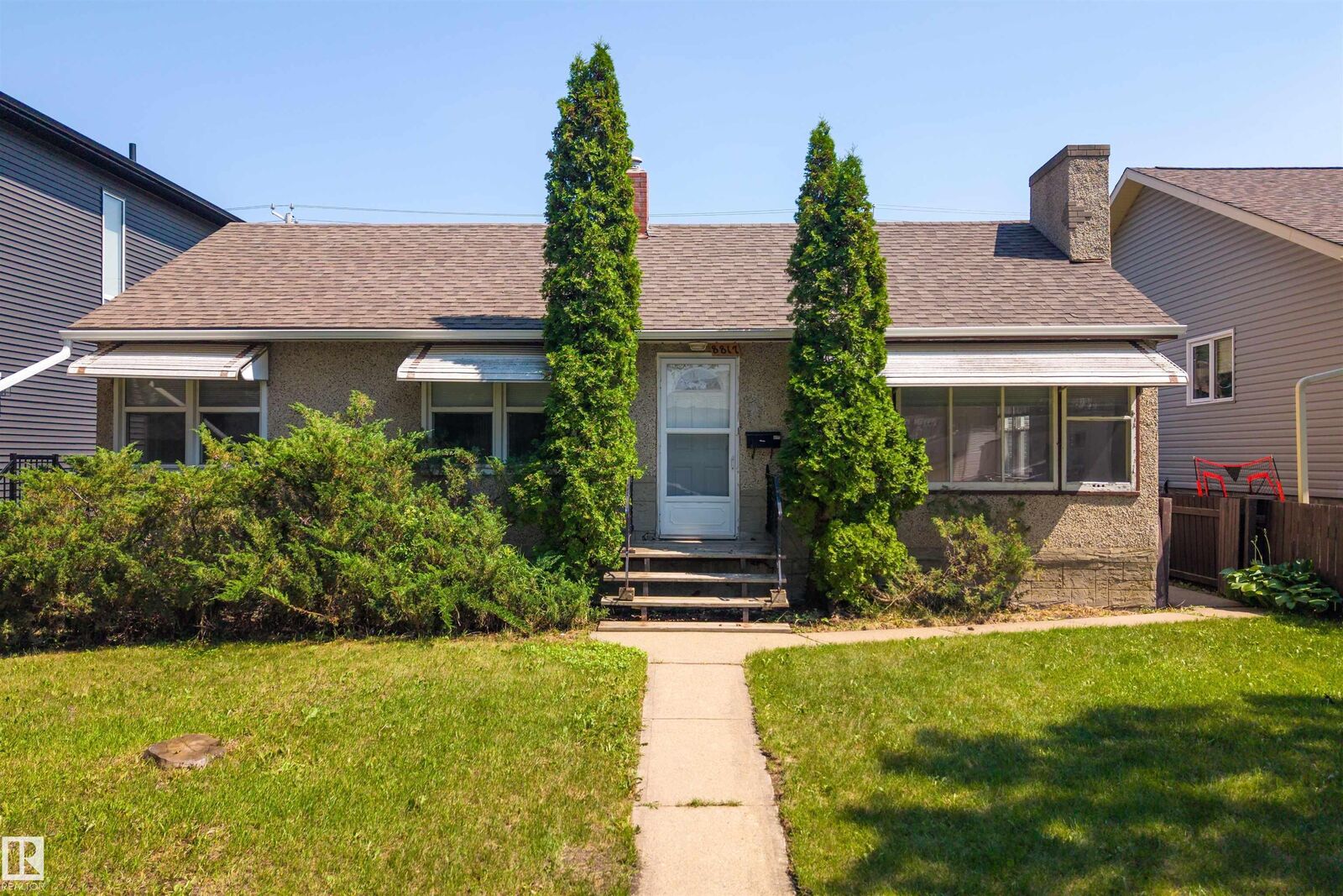 Property Photo: 8817 91 Street NW AB T6C 3N3