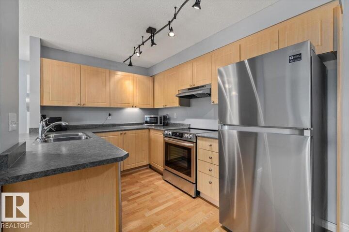 Property Photo: 622 McAllister Loop SW 207 AB T6W 1N2