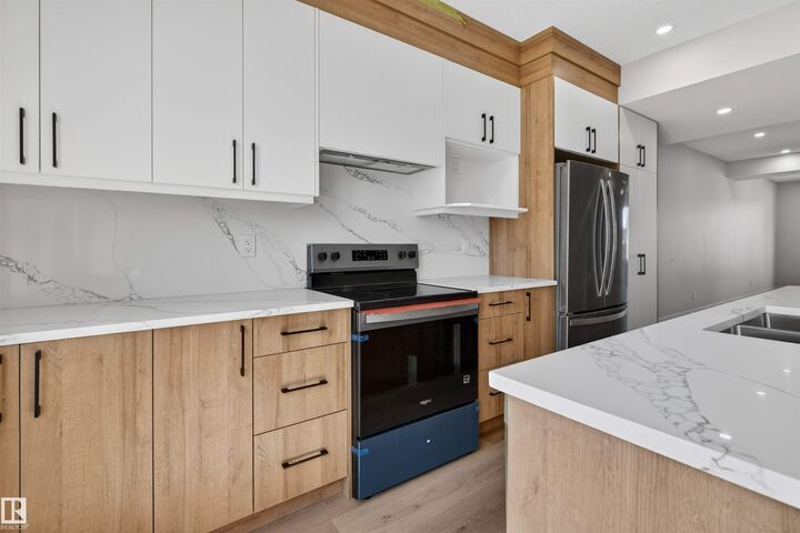 Property Photo: 10707-09 128 Avenue NW AB T5E 0J4