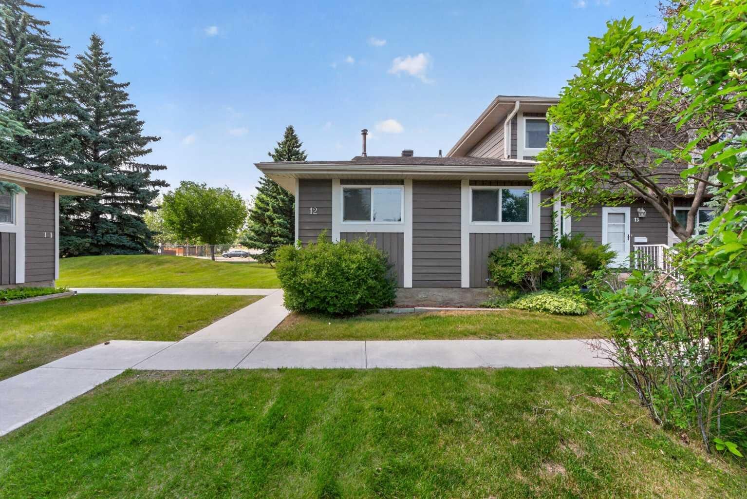 Property Photo:  14736 Deerfield Drive SE 12  AB T2J 5Y1 