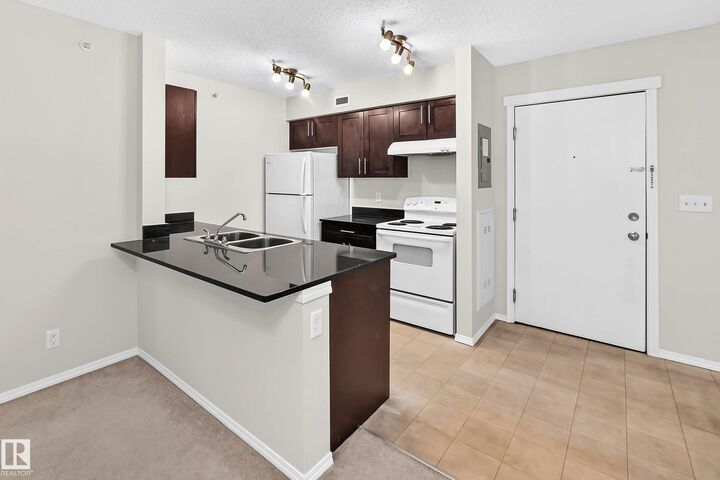 Property Photo:  12025 22 Avenue SW 404  AB T6W 2Y1 