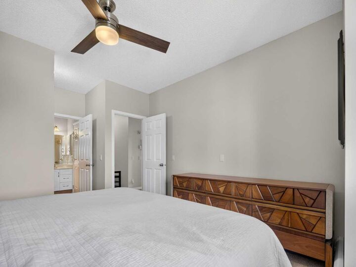 Property Photo: 72 Quigley Drive 201 AB T4C 2K6