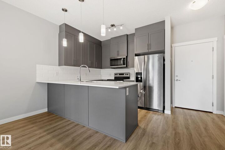 Property Photo: 812 Welsh Drive SW 121 AB T6X 1Y7