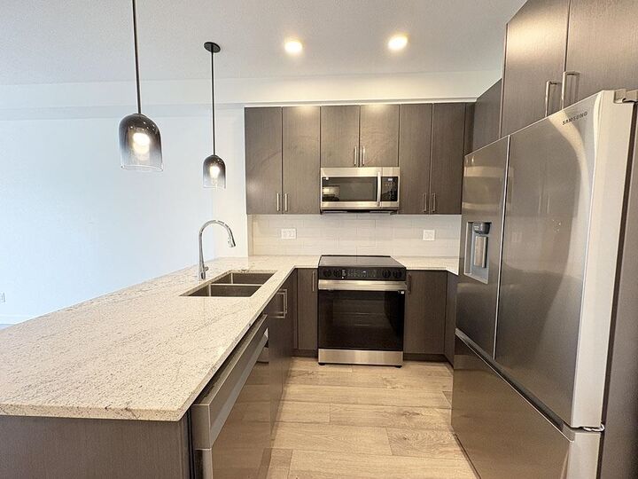 Property Photo:  5504 Brydon Crescent 203  BC V3A 0R3 