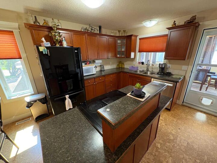 Property Photo:  10032 102 Street  AB T8S 1S5 