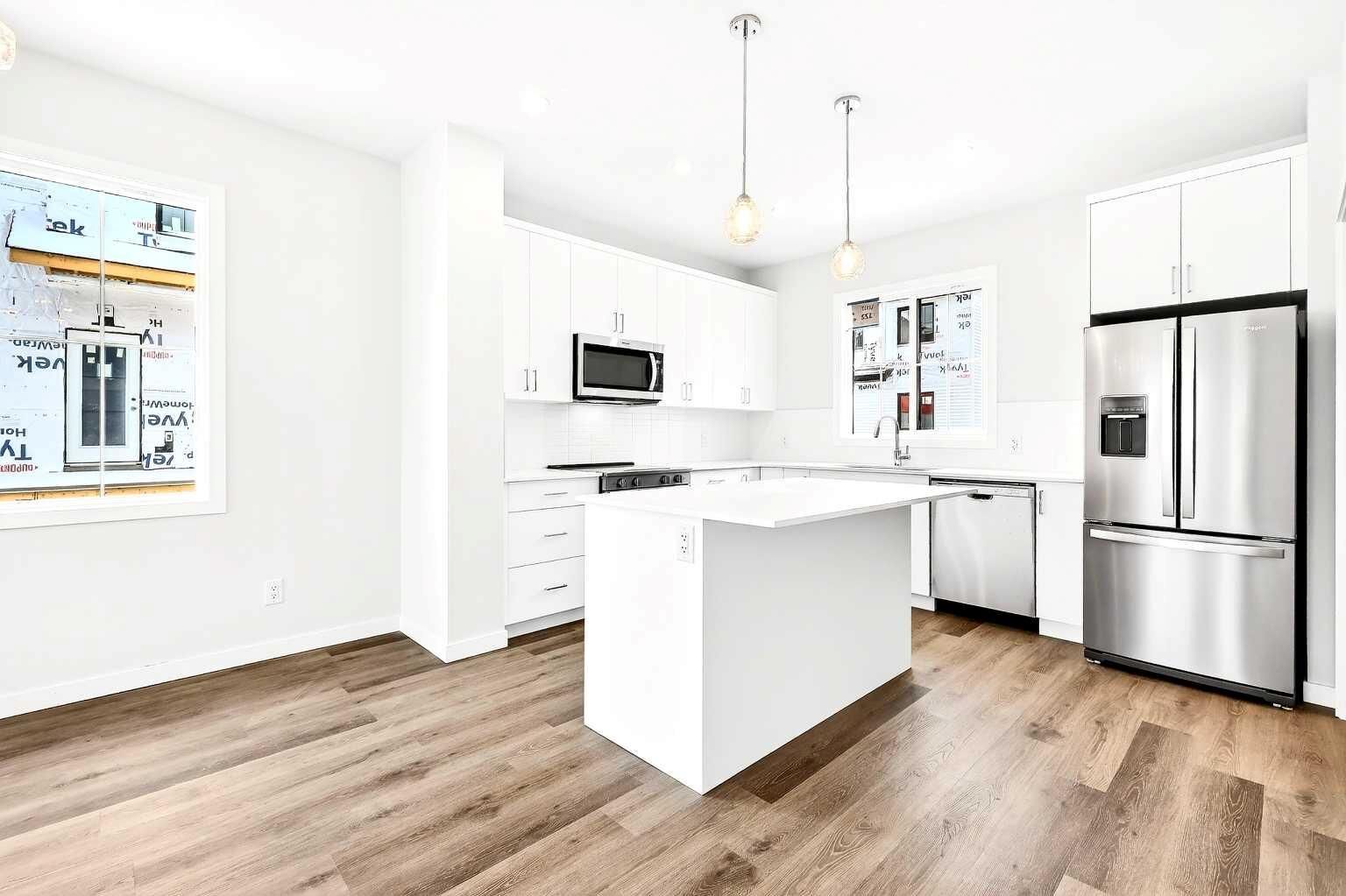Property Photo: 40 Creekside Way SW 301 AB T2X 6E2