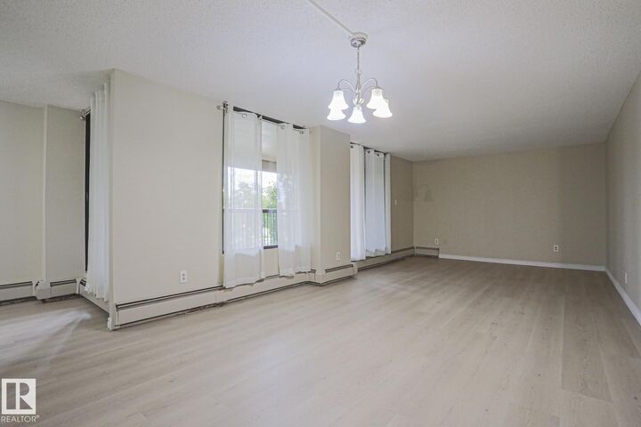 Property Photo: 8220 Jasper Avenue NW 102 AB T5H 4B6