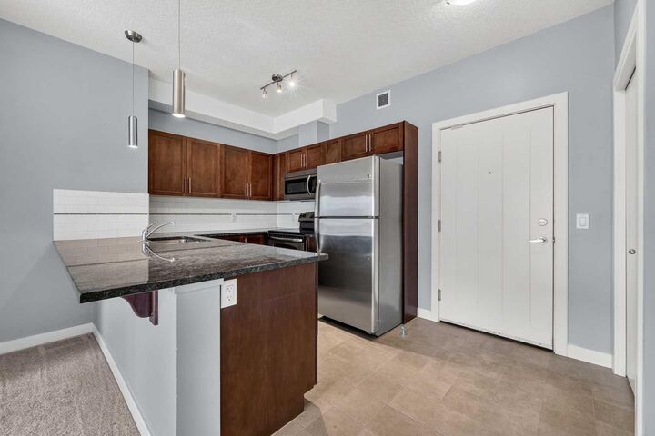Property Photo:  604 East Lake Boulevard NE 2405  AB T4A 0G6 