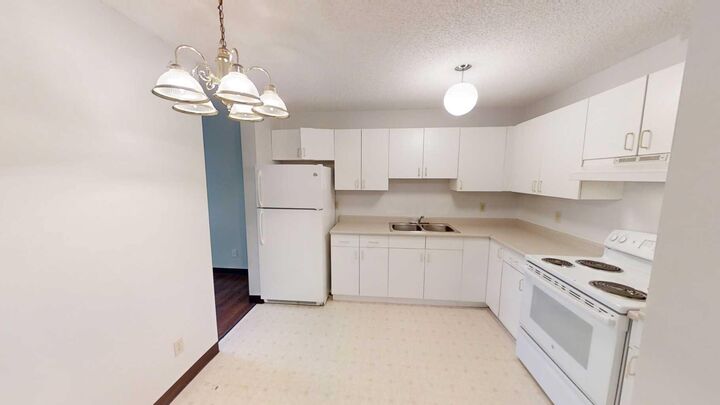 Property Photo:  5117 44 Street 201  AB T0G 1E0 
