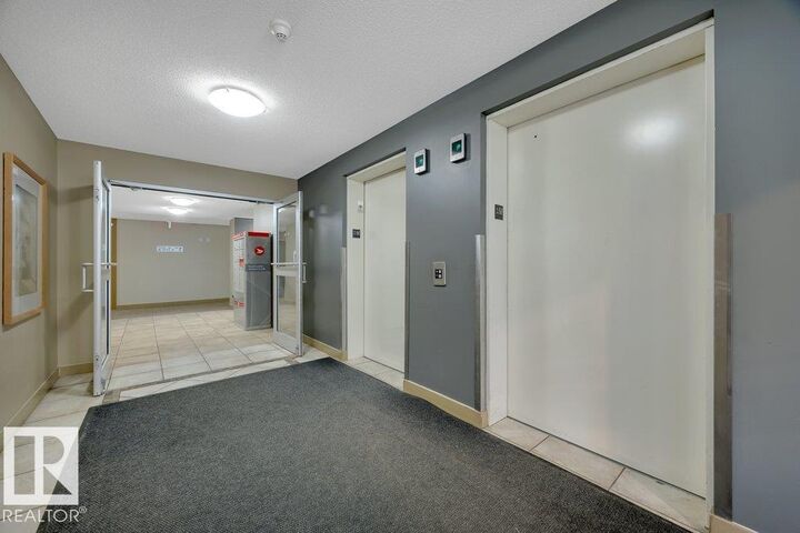 Property Photo: 17011 67 Avenue NW 122 AB T5T 6Y6