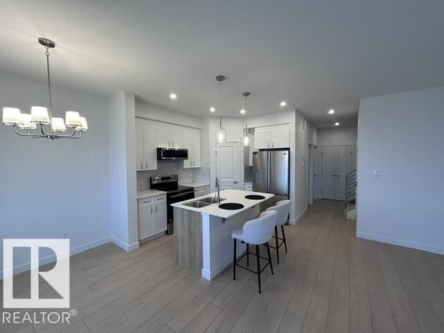 Property Photo: 20936 16 Av NW AB T6M 3J4