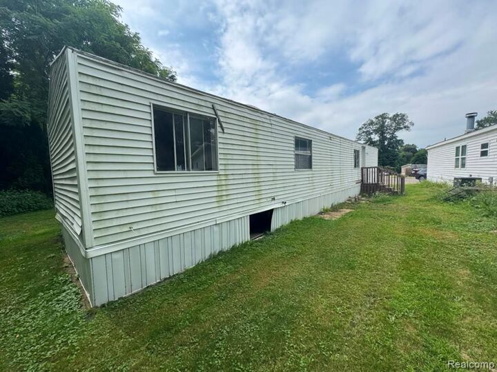 Property Photo:  926 Hill St Lot #18  MI 48875 1563 