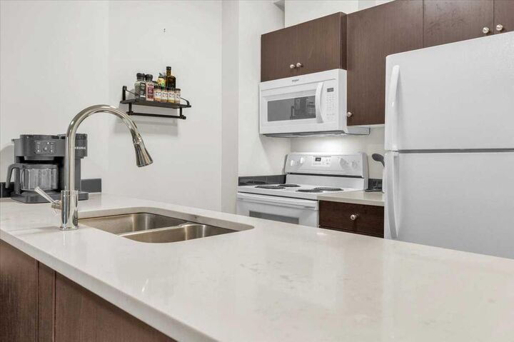 Property Photo: 73 Erin Woods Court SE 1108 AB T2B 3V2