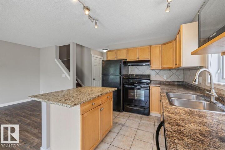 Property Photo:  1428 Hodgson Way NW 69  AB T6R 3P8 