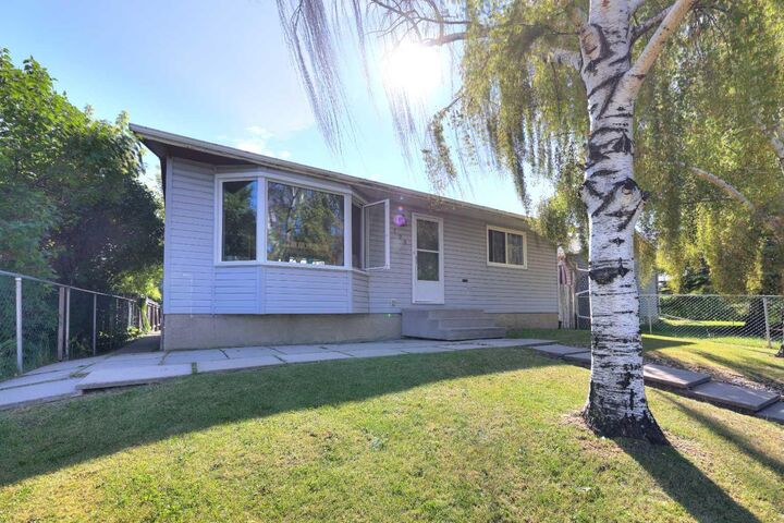 Property Photo: 108 Pinecliff Way NE AB T1Y 3X3