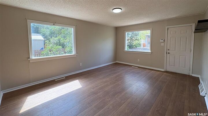 Property Photo:  647 Robinson Street  SK S4T 2L9 
