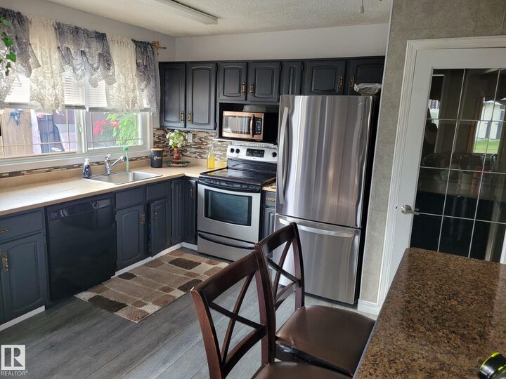 Property Photo:  11440 144 Avenue NW  AB T5X 1L8 