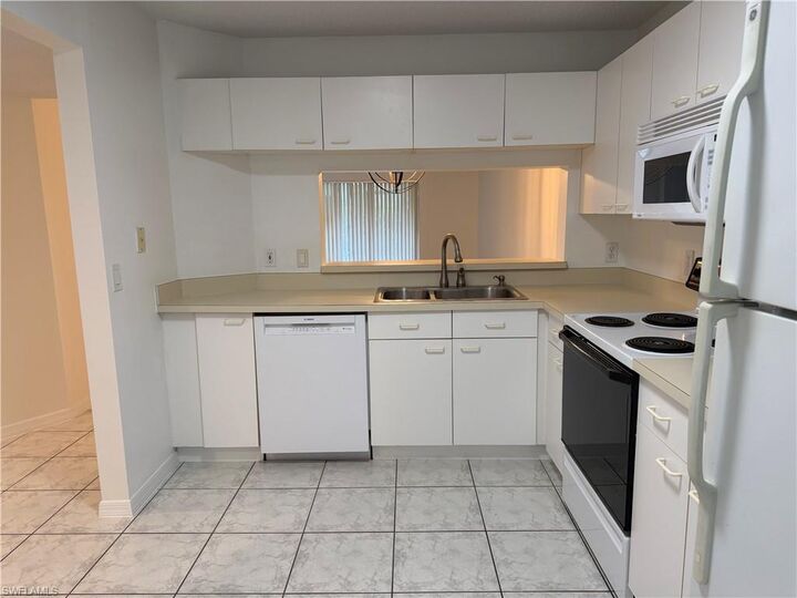 Property Photo: 7755 Jewel Ln 103 FL 34109