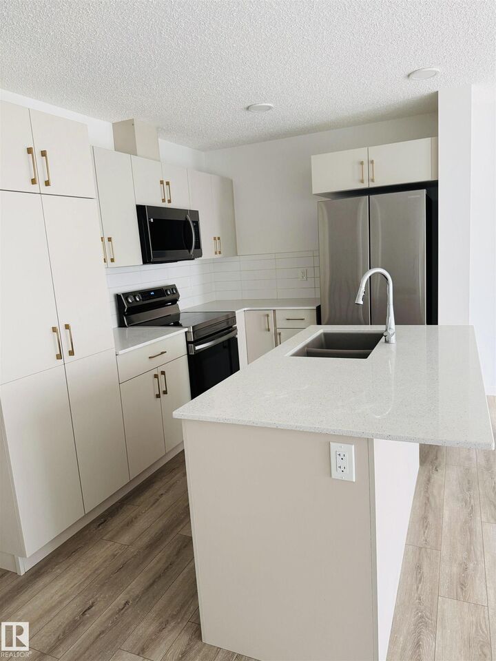 Property Photo:  905 172 Street SW 4  AB T6W 5L8 