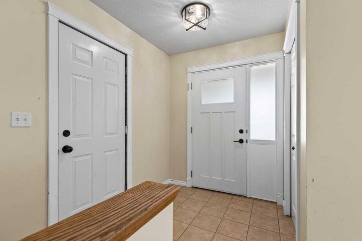 Property Photo:  17 Sheep River Crescent  AB T1S 1N6 