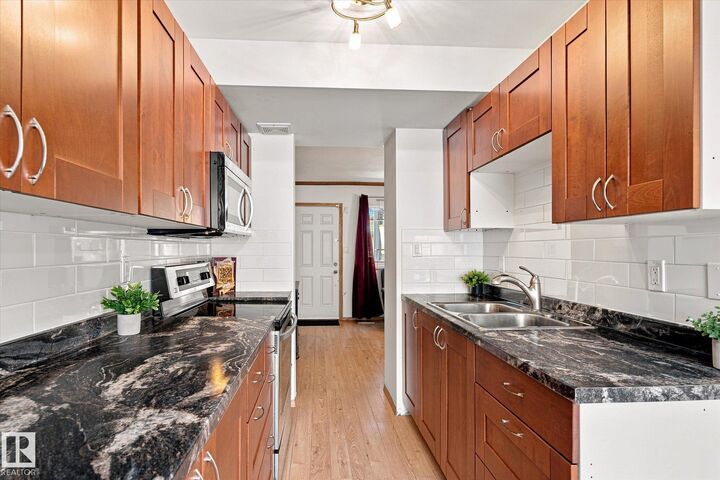 Property Photo:  790 Abbottsfield Road NW  AB T5W 4R4 