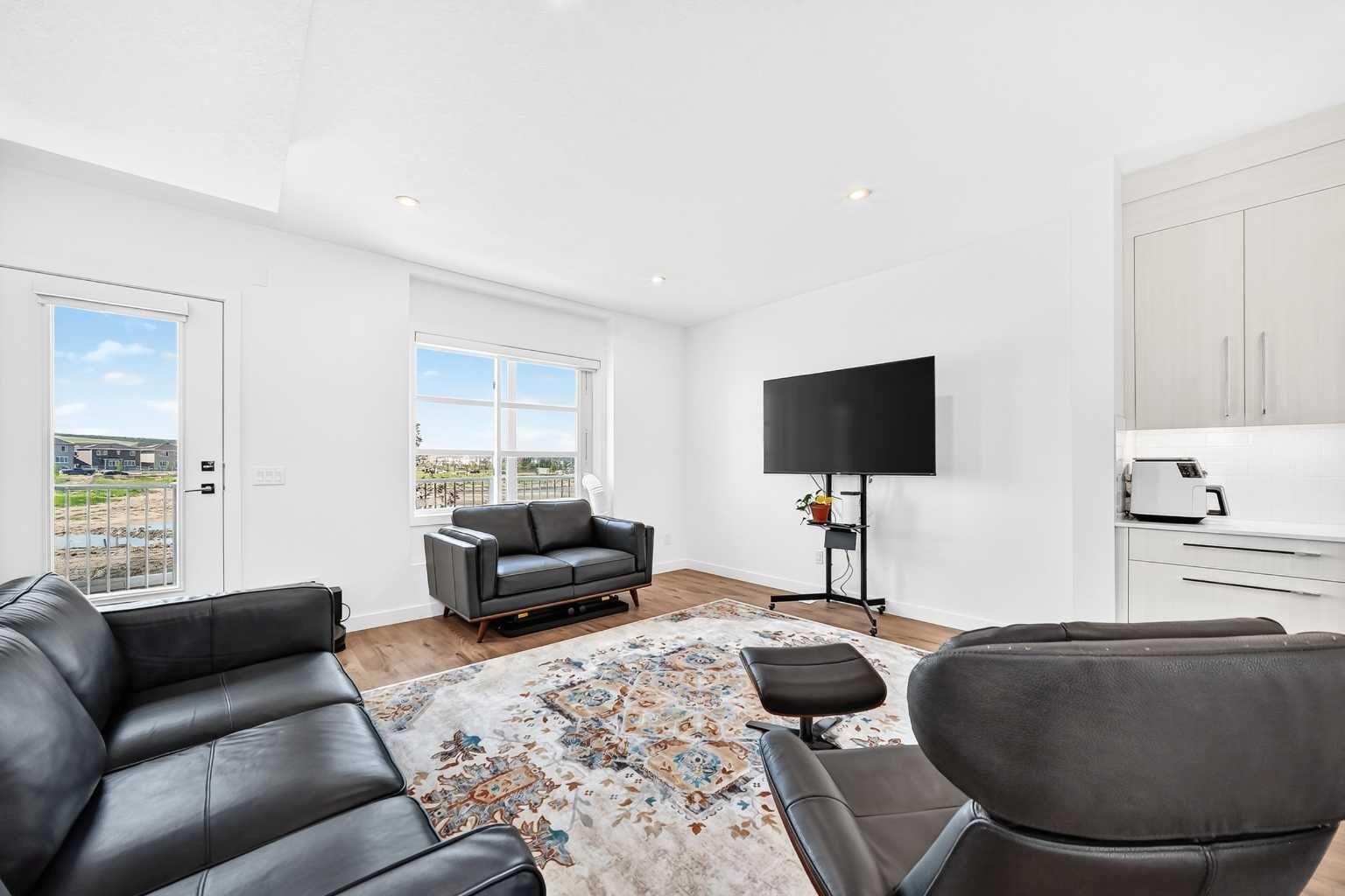Property Photo:  135 Belmont Passage SW 308  AB T2X 4N4 