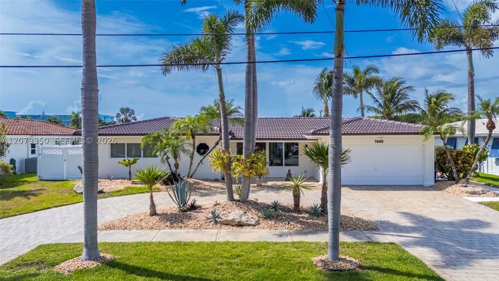 Property Photo:  1440 SE 14th Dr  FL 33441 