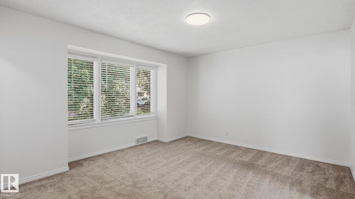 Property Photo:  11836 62 Street NW  AB T5W 4C4 